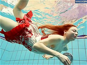 scorching polish redhead swimming in the pool