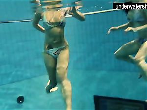two splendid amateurs showing their bodies off under water